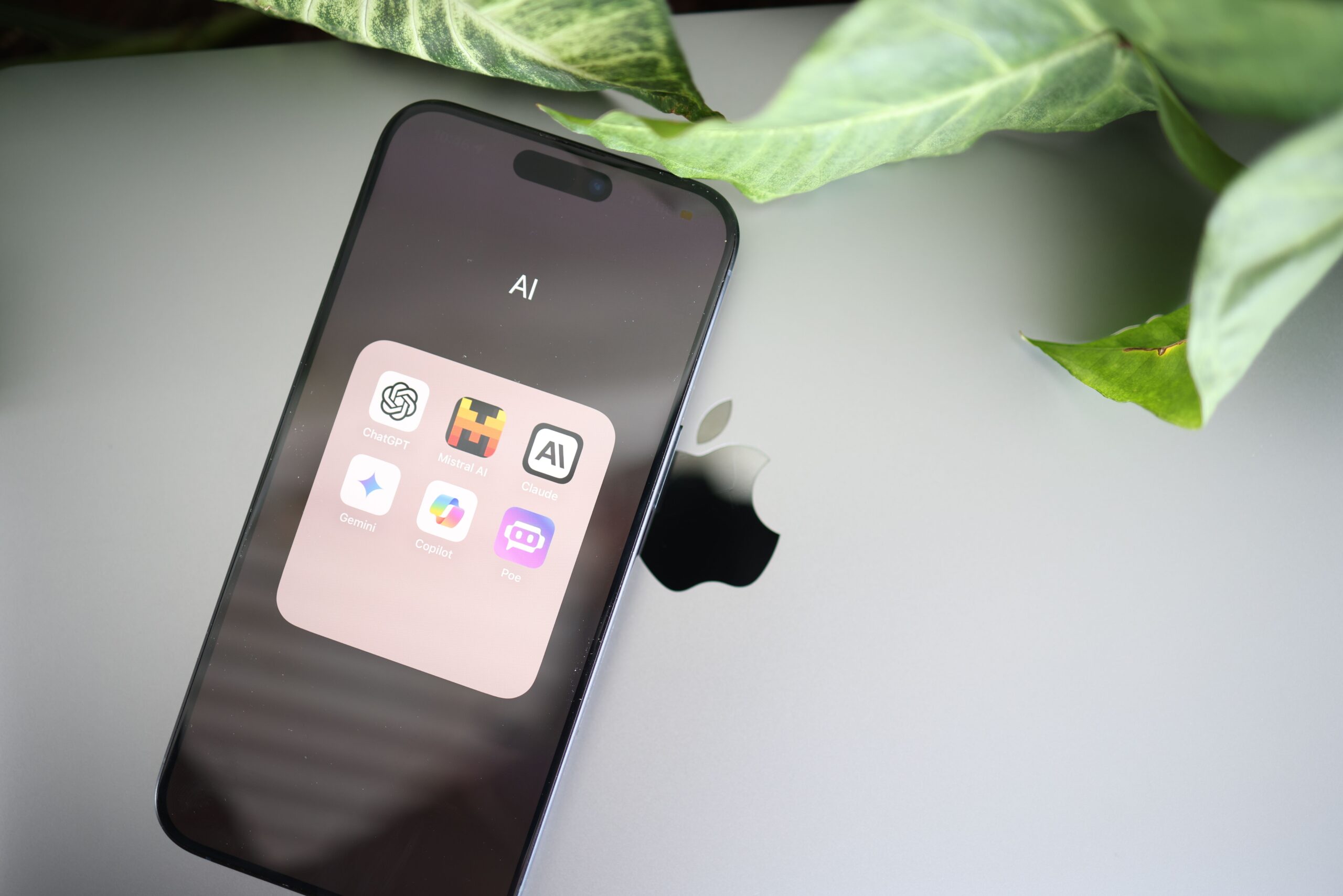 AI apps and digital tools on a smartphone and laptop