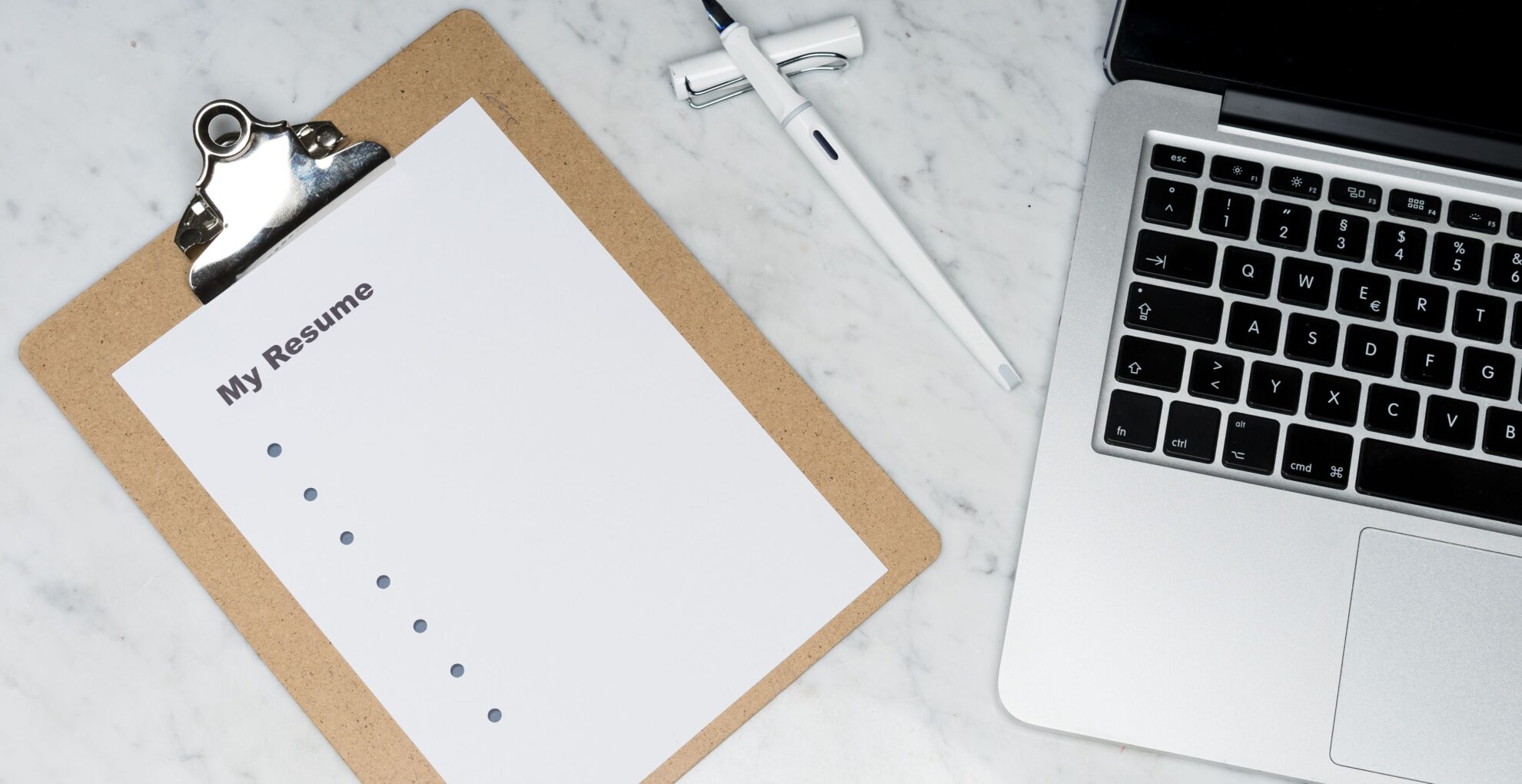 Professional Resume Writing Services: How to Choose the Right One in 2026 Professional resume and laptop for job application